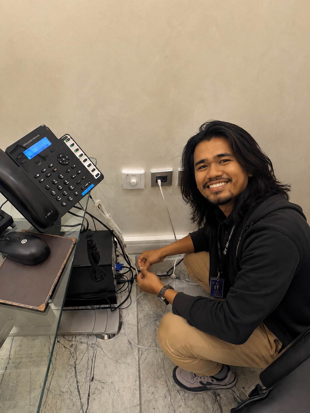 Comtech Systems Engineer deploying workstation wiring